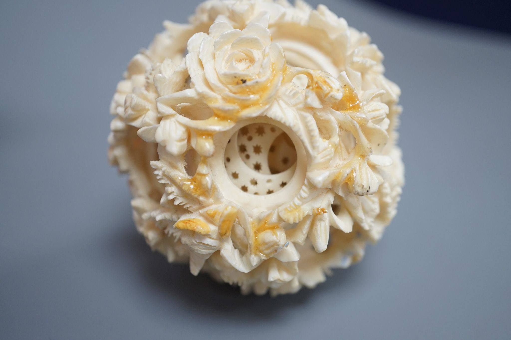 An early 20th century Chinese ivory concentric puzzle ball and stand 20cm total height